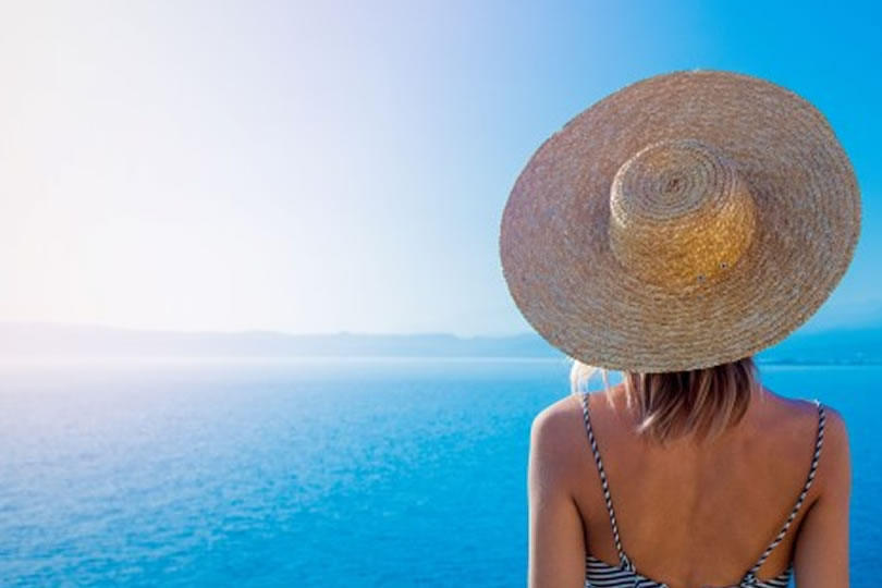 Greece woman and hat in sunshine
