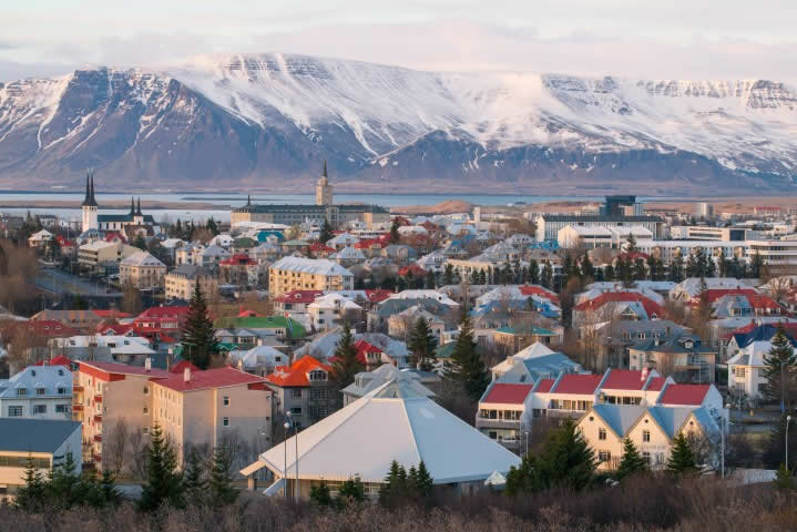 Reykjavik city and snowy mountains